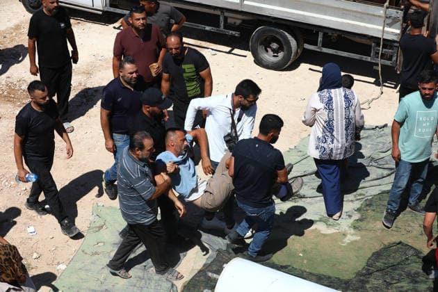 Israeli forces demolish Palestinian home in West Bank HEBRON, PALESTINE - JULY 20: A Palestinian man is assisted after fainting as Israeli forces demolished the home of Palestinian Ahmed Masalmeh in Beit Awwa, Hebron, West Bank, on July 20, 2026. The house was demolished on the grounds that it had been built without a permit. Palestinians gathered at the demolished home in the aftermath of the operation. Wisam Hashlamoun Anadolu Hebron West Bank. Editorial use only. Please get in touch for any other usage.  Copyright: x2026xAnadoluxWisamxHashlamounx