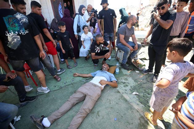 Israeli forces demolish Palestinian home in West Bank HEBRON, PALESTINE - JULY 20: A Palestinian man lies unconscious after fainting as Israeli forces demolished the home of Palestinian Ahmed Masalmeh in Beit Awwa, Hebron, West Bank, on July 20, 2026. The house was demolished on the grounds that it had been built without a permit. Palestinians gathered at the demolished home in the aftermath of the operation. Wisam Hashlamoun Anadolu Hebron West Bank. Editorial use only. Please get in touch for any other usage.  Copyright: x2026xAnadoluxWisamxHashlamounx