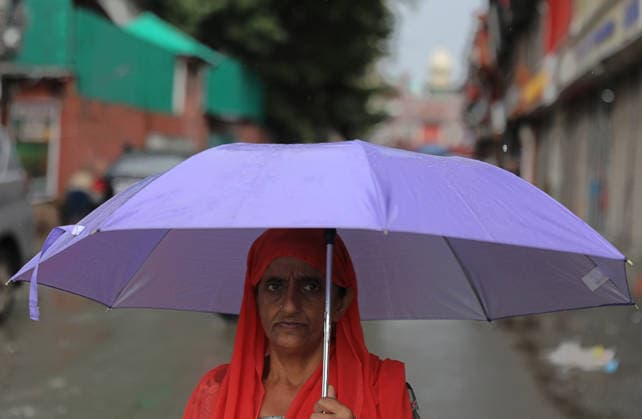 Rain in Srinagar A woman holds her umbrella after heavy rainfall in Srinagar July, 20, 2026. Srinagar India  Copyright: xMatrixxImagessx DanishxIsmailx