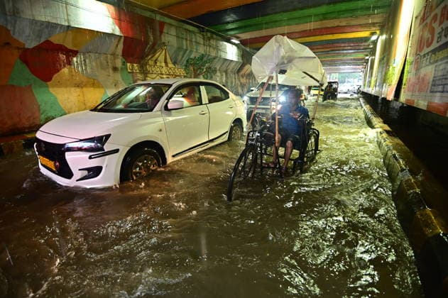 July 20, 2026, Prayagraj, Uttar Pradesh, India: Prayagraj: Vehicle ply trough a waterlogged railway under pass after heavy rain, in Prayagraj on Monday, July 20, 2026. Prayagraj India - ZUMAv115 20260720_zap_v115_018 Copyright: xPrabhatxKumarxVermax