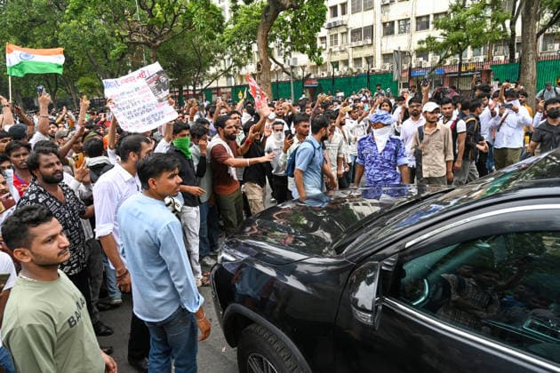 NEW DELHI, INDIA - JULY 20: Supporters of the Cockroach Janta Party (CJP) raise slogans after breaching security barricades on DR Rajendra Prasad Road near Parliament House on July 20, 2026 in New Delhi, India. Delhi Police later used tear gas to disperse the protesters as they demanded the resignation of Union Education Minister Dharmendra Pradhan over alleged examination irregularities. (Photo by Ajay Aggarwal Hindustan Times) Delhi Police Use Lathi Charge And Tear Gas Shells To Disperse CJP Supporters During Their March To Parliament