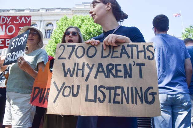 July 20, 2026, London, England, United Kingdom: A protester holds a 2700 deaths sign as climate activists from the group Fossil Free London stage a protest outside Downing Street against Rosebank and other oil and gas projects in the North Sea ahead of the arrival of Andy Burnham, who replaces Keir Starmer as the UK Prime Minister. London United Kingdom  - ZUMAv130 20260720_zip_v130_025 Copyright: xVukxValcicx