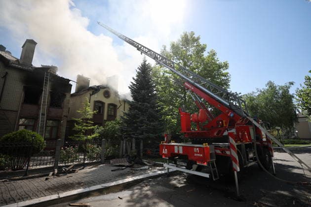 RUSSIA, DONETSK - JULY 20, 2026: A fire crew battles fires at residential buildings after a Ukrainian military strike on Kuibyshevsky neighbourhood. Dmitry Yagodkin TASS  95262630