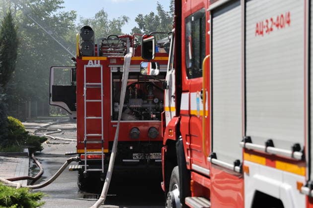 RUSSIA, DONETSK - JULY 20, 2026: Fire crews battle fires at residential buildings after a Ukrainian military strike on Kuibyshevsky neighbourhood. Dmitry Yagodkin TASS  95262626