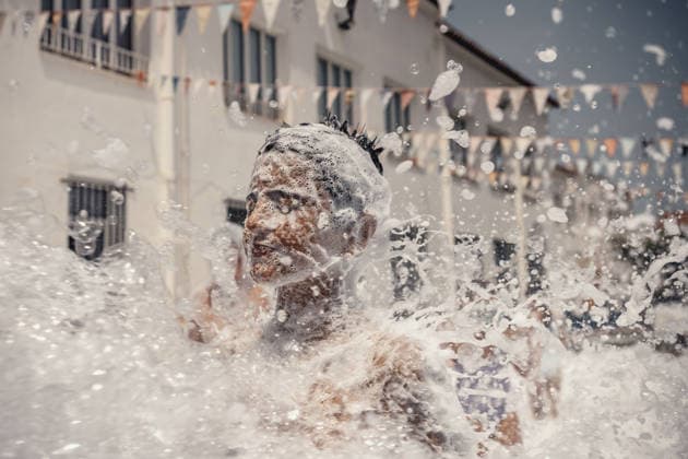 July 20, 2026, Es Mercadal, Menorca Balearic Islands, Spain: Children get covered in foam as they participate in a foam party looking for some refreshment during the traditional Sant Marti Festival in Es Mercadal Es Mercadal Spain - ZUMAo105 20260720_fap_o105_022 Copyright: xMatthiasxOesterlex