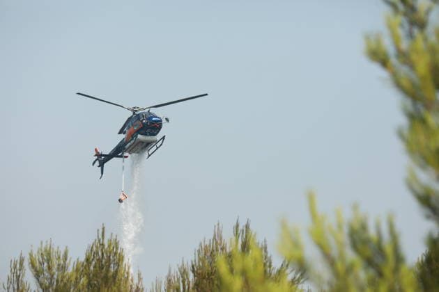Firefighting helicopters battle wildfire in southern France TARADEAU, FRANCE - JULY 20: Firefighting helicopters drop water on a wildfire near Taradeau in the Var department of southern France on July 20, 2026. Two wildfires broke out in France s southern Var department on Sunday, burning around 90 hectares (222 acres) and forcing evacuations, local authorities said. A rapidly spreading blaze first burned around 30 hectares in Taradeau before spreading to the neighboring commune of Les Arcs, where another 60 hectares were scorched, the Var Prefecture said on the US social media company X. The prefecture said strong winds and drought-stricken vegetation were fueling the rapid spread of the fire. Authorities evacuated several hamlets, while t  Copyright: x2026xAnadoluxMohamadxSalaheldinxAbdelghanixAlsayedx