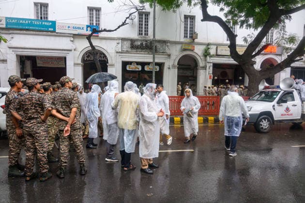 July 20, 2026, New Delhi, New Delhi, India: NEW DELHI, India Ã¢â‚¬ Police personnel in raincoats gather near Connaught Place as rain falls while security forces attempt to stop protesters from advancing further, during demonstrations by the Cockroach Janata Party (CJP) demanding the resignation of Education Minister Dharmendra Pradhan over alleged irregularities in the NEET-UG exam, July 20, 2026. New Delhi India  - ZUMAm184 20260720_zip_m184_017 Copyright: xAnkitxRoyxMajumderx