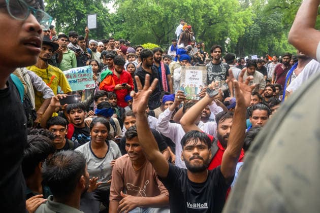 July 20, 2026, New Delhi, New Delhi, India: NEW DELHI, India Ã¢â‚¬ Protesters, one holding a copy of India s Constitution, raise their hands and shout slogans at Jantar Mantar during demonstrations by the Cockroach Janata Party (CJP) demanding the resignation of Education Minister Dharmendra Pradhan over alleged irregularities in the NEET-UG exam, July 20, 2026. New Delhi India  - ZUMAm184 20260720_zip_m184_036 Copyright: xAnkitxRoyxMajumderx