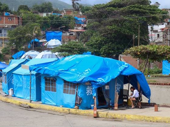 Displaced families remain in temporary shelters in La Guaira LA GUAIRA, VENEZUELA JULY 20, 2026: Temporary shelters are seen housing families displaced by the recent earthquakes in La Guaira, Venezuela. Many residents whose homes were destroyed remain in tents as humanitarian assistance, debris removal and reconstruction efforts continue. Recent rainfall has further complicated conditions in the temporary camps. La Guaira Venezuela (Bolivarian Republic of) Copyright: x xMarioxFloresx xJNAxPressx
