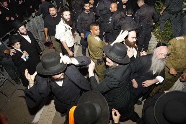 July 20, 2026, Cfar Yona, Israel: CFAR YONA, ISRAEL Ã¢â‚¬ JULY 20, 2026: Ultra-Orthodox Jewish demonstrators, including members of the Gur Hasidic community, gather outside Military Prison 10 to protest the arrest of a Haredi man accused of evading compulsory military service. Organisers estimated that more than 20,000 people took part in the demonstration, which escalated into clashes and created hazardous conditions for journalists covering the event. JNA Press Cfar Yona Israel  - ZUMAq101 20260720_zna_q101_247 Copyright: xHilelxBenxOrx