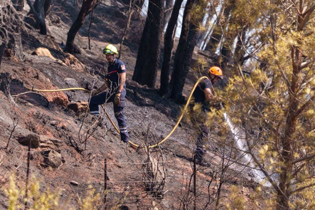 South France suffers from wildfires after another heatwave. France - Les Arcs, 20.07.2026 The firefighters extinct the last embers as wildfires burning near Les Arcs-sur-Argens in southeastern France on Monday. The blaze was one of several wildfires affecting the country during a period of extreme heat, longer lasting drought and strong winds, led to evacuations and a large-scale firefighting response. DÃ partement Var