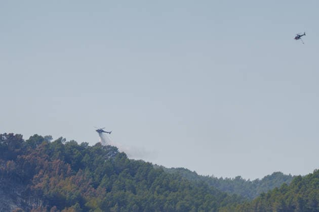 South France suffers from wildfires after another heatwave. France - Les Arcs, 20.07.2026 Firefighting helicopters equipped with a snorkel flies over during the aerial firefighting as wildfires burning near Les Arcs-sur-Argens in southeastern France on Monday. The blaze was one of several wildfires affecting the country during a period of extreme heat, longer lasting drought and strong winds, led to evacuations and a large-scale firefighting response. DÃ partement Var