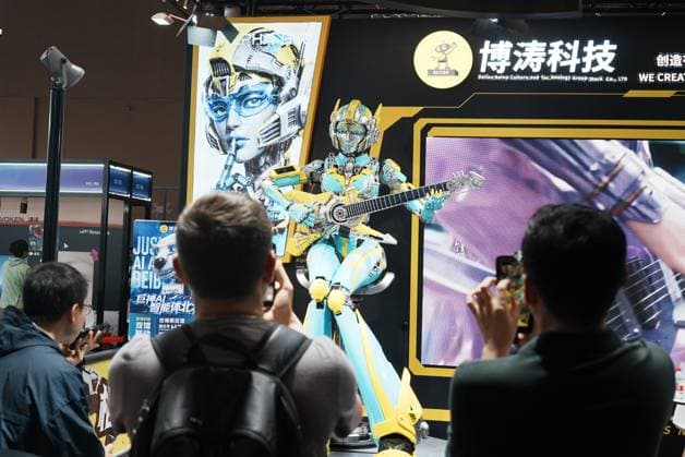SHANGHAI, CHINA - JULY 20: Visitor take photos in Betop Culture Technology booth during the 2026 World AI Conference on July 20, 2026 in Shanghai, China. The conference showcases latest advancements in artificial intelligence and robotics technologies.  Copyright: xVCGx 111655410356