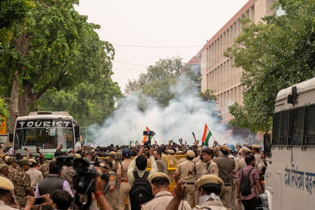 Cockroach Janta Party (CJP) march to Parliament in New Delhi, India - 20 Jul 2027 Police fire tear gas towards protesters during a demonstration organized by the Cockroach Janta Party (CJP) marching towards Parliament. The protesters had been staging a sit-in at the protest site for nearly 30 days before announcing a march toward the Indian Parliament. They demanded the resignation of Union Education Minister Dharmendra Pradhan over alleged examination irregularities and called for the release of activist Sonam Wangchuk who was taken into custody and hospitalized following a prolonged hunger strike. New Delhi India Copyright: xPradeepxGaurx xSOPAxImagesx DSC_2117