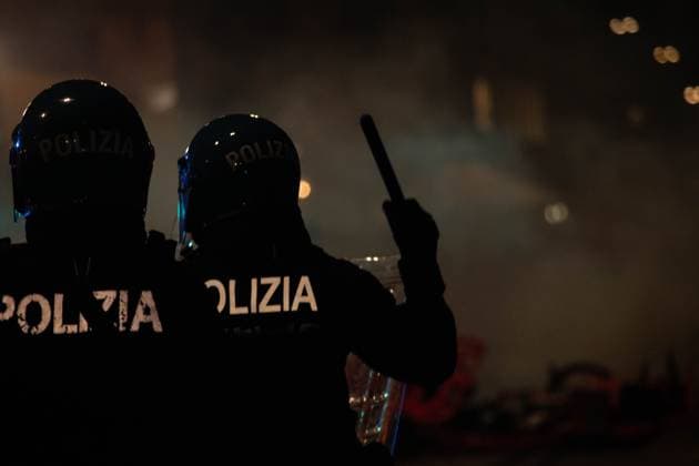 Thousands protest in Bologna over death of Abderrahim Fakir BOLOGNA, ITALY JULY 20, 2026: Thousands of people gather in Piazza del Nettuno in Bologna to demand justice for Abderrahim Fakir, a 43-year-old Italian-Moroccan man who died following a police intervention. Protesters accuse police of using excessive force during the arrest. The demonstration begins peacefully before groups of protesters move into nearby streets, where clashes erupt with riot police. Authorities deploy tear gas and water cannons as demonstrators throw stones and firecrackers during the confrontation. Bologna Italy Copyright: x xNadiaxCaimix xJNAxPressx