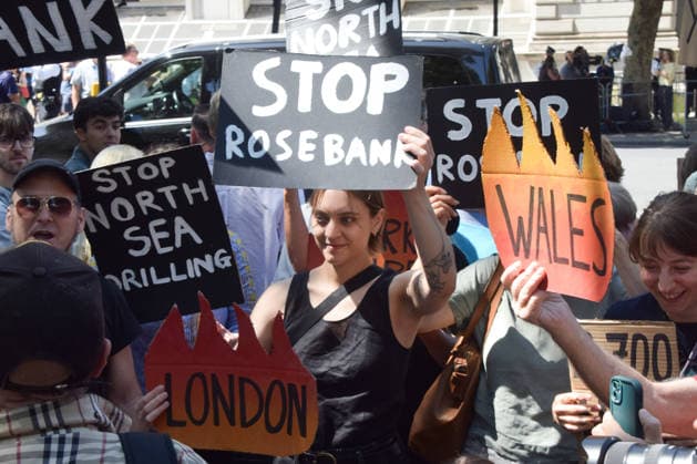 July 20, 2026, London, England, United Kingdom: Climate activists from the group Fossil Free London stage a protest outside Downing Street against Rosebank and other oil and gas projects in the North Sea ahead of the arrival of Andy Burnham, who replaces Keir Starmer as the UK Prime Minister. London United Kingdom  - ZUMAv130 20260720_zip_v130_056 Copyright: xVukxValcicx