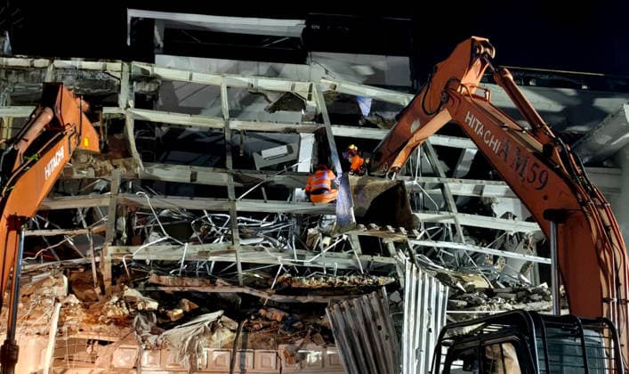 (260721) -- MEDAN, July 21, 2026 -- This photo provided by Indonesia s National Search and Rescue Agency (Basarnas) Medan shows rescuers working at the scene after a powerful explosion in a residential complex in Medan, North Sumatra, Indonesia, July 21, 2026. A powerful explosion tore through a three-story house in a residential complex in the western Indonesian city of Medan on Monday evening, killing three people and causing extensive damage to surrounding properties, authorities said Tuesday. ( Handout via Xinhua) (SpotNews) INDONESIA-MEDAN-RESIDENTIAL COMPLEX-EXPLOSION-AFTERMATH BasarnasxMedan 