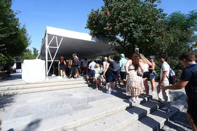 July 21, 2026, Athens, Greece: Police officers secure the area near the entrance to the Acropolis archaeological site in Athens, Greece, after a man allegedly stabbed two American tourists. The two injured visitors received medical treatment, while the suspect was detained by authorities. An investigation into the incident is ongoing. Athens Greece - ZUMAv62_ 20260721_zaf_v62_001 Copyright: xAristidisxVafeiadakisx