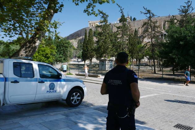 July 21, 2026, Athens, Greece: Police officers secure the area near the entrance to the Acropolis archaeological site in Athens, Greece, after a man allegedly stabbed two American tourists. The two injured visitors received medical treatment, while the suspect was detained by authorities. An investigation into the incident is ongoing. Athens Greece - ZUMAv62_ 20260721_zaf_v62_004 Copyright: xAristidisxVafeiadakisx