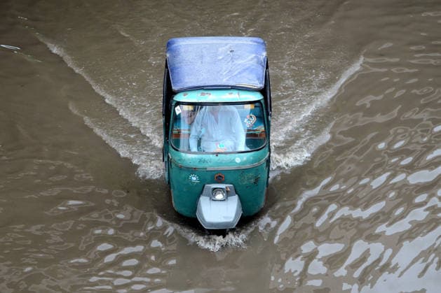 Heavy monsoon rains flood roads in Pakistan s Peshawar PESHAWAR, PAKISTAN - JULY 21: A rickshaw moves through floodwaters on the Grand Trunk (GT) Road following heavy monsoon rainfall in Peshawar, Pakistan, on July 21, 2026. Widespread monsoon rains caused severe flooding across Khyber Pakhtunkhwa, disrupting traffic and daily life. The ongoing rains have also resulted in fatalities and injuries in different parts of the province, while damaging homes, roads, bridges, crops, and livestock. Rescue and relief operations are ongoing as authorities continue to monitor the situation. Hussain Ali Anadolu Peshawar Pakistan. Editorial use only. Please get in touch for any other usage.  Copyright: x2026xAnadoluxHussainxAlix