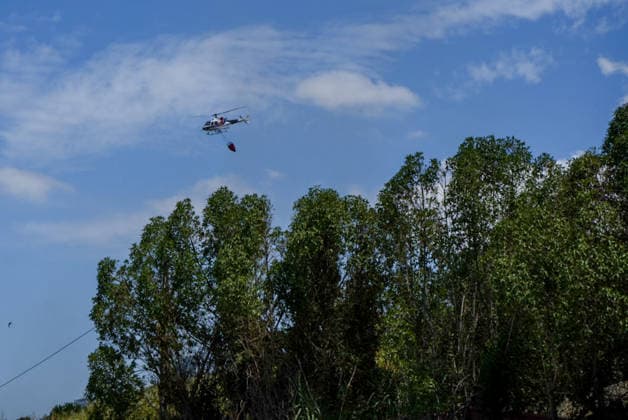 Wildfire Near Lisbon A firefighting helicopter drops water over a wildfire near Lisbon, Portugal, on July 21, 2026, as emergency crews work to contain the blaze amid high temperatures and dry conditions. Lisbon Portugal  Copyright: xLuisxBozax originalFilename: boza-notitle260721_npT8X.jpg