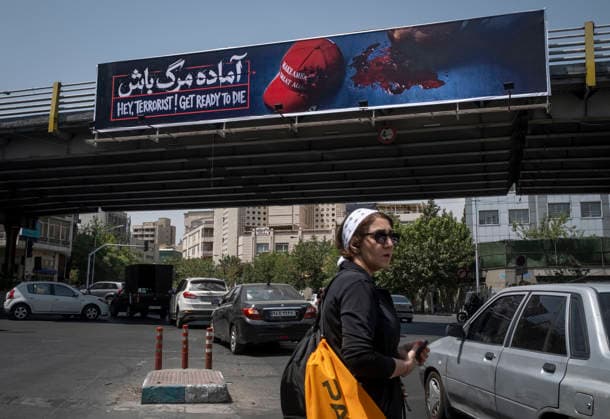 Anti‘Trump Messaging Appears On Billboards In Tehran A young Iranian woman crosses an avenue beneath an anti-U.S. President Donald Trump billboard in downtown Tehran, Iran, on July 21, 2026, amid renewed conflicts between Iran and the United States in southern Iran. MORTEZA NIKOUBAZL NurPhoto Tehran Tehran Iran  Copyright: xMortezaxNikoubazlx originalFilename: nikoubazl-antitrum260721_nphg4.jpg