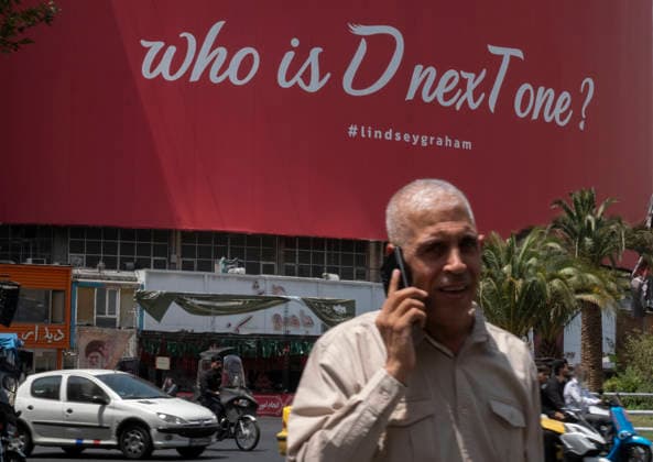 Anti‘Trump Messaging Appears On Billboards In Tehran An elderly Iranian man speaking on his cell phone walks beneath an anti-U.S. President Donald Trump billboard in downtown Tehran, Iran, on July 21, 2026, amid renewed conflicts between Iran and the United States in southern Iran. MORTEZA NIKOUBAZL NurPhoto Tehran Tehran Iran  Copyright: xMortezaxNikoubazlx originalFilename: nikoubazl-antitrum260721_npyXU.jpg