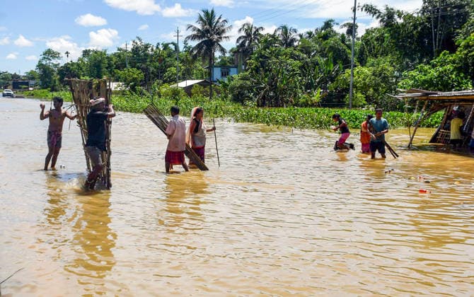 Villagers wade through flood water at Teok Jorhat, Jul 21 (ANI): Villagers wade through flood water at Teok, in Jorhat on Tuesday. Jorhat Assam India Copyright: xANIx ANI_20260721485