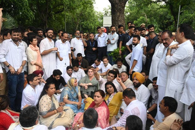 NEW DELHI, INDIA - JULY 21: Leader of Opposition in the Lok Sabha Rahul Gandhi with Priyanka Gandhi Vadra, Kerala Chief Minister VD Satheesan, Congress MP KC Venugopal, and others, stages a sit-in protest near the Prime Minister s residence in solidarity with students protesting over alleged irregularities in the NEET examination, on July 21, 2026 in New Delhi, India. The spontaneous demonstration at Lok Kalyan Marg unfolded a day after security forces used tear gas and lathi charges to disperse student marchers led by the Cockroach Janata Party (CJP) near Parliament Street. Rahul Gandhi demanded the immediate resignation of Union Education Minister Dharmendra Pradhan and an urgent, dedicated debate in Parliament regarding the NEET paper l