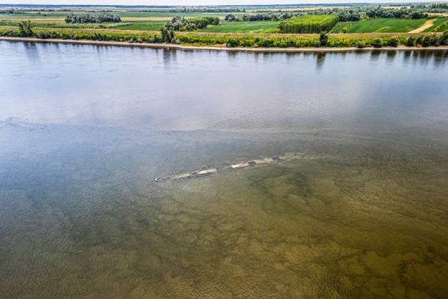 Low water reveals remains of century-old ship on Croatia s Danube An aerial view shows the remains of a ship believed to be more than a century old after record-low water levels in the Danube River exposed the wreck in Opatovac, Croatia, on July 21, 2026. The vessel is believed to have sunk between the two World Wars.  DavidxJerkovic PIXSELL