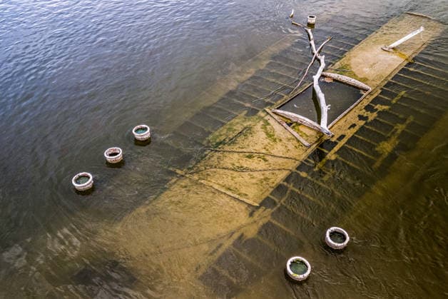 Low water reveals remains of century-old ship on Croatia s Danube An aerial view shows the remains of a ship believed to be more than a century old after record-low water levels in the Danube River exposed the wreck in Opatovac, Croatia, on July 21, 2026. The vessel is believed to have sunk between the two World Wars.  DavidxJerkovic PIXSELL
