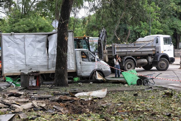 A woman captures damage caused by a Russian combined strike near a truck, Odesa, Ukraine, July 21, 2026. The Russian army carried out a missile and drone attack on the southern Ukrainian port city and the region. The attack damaged the residential building, nearby structures and cars. Three people were injured. (Photo by Nina Liashonok Ukrinform) Russians attack historical centre in Odesa  Copyright: xNinaxLiashonokx