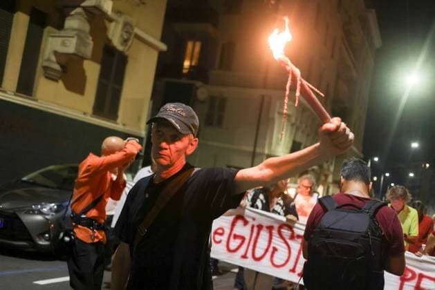 Vigil marks 25th anniversary of Diaz school raid in Genoa GENOA, ITALY JULY 21, 2026: People attend a remembrance vigil marking the 25th anniversary of the police raid on the Diaz school during the 2001 G8 summit in Genoa. The gathering commemorated those injured in the operation and called attention to concerns over police violence and the suppression of dissent during the summit protests. Genova Berlin Italy Copyright: x xZairaxBiaginix xJNAxPressx