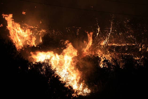 Wildfires continue in Italian island of Sicily PALERMO, ITALY - JULY 22: Wildfires that broke out in several parts of the Italian island of Sicily continue overnight, fueled by strong winds, as firefighters, civil protection teams and forestry crews press on with efforts to contain the blazes near Palermo, Sicily, Italy on July 22, 2026. The wildfires, which started yesterday on the slopes of Mount Longa near the city of Palermo, spread rapidly due to the wind and burned throughout the night. Alberto Lo Bianco Anadolu Palermo Italy. Editorial use only. Please get in touch for any other usage.  Copyright: x2026xAnadoluxAlbertoxLoxBiancox