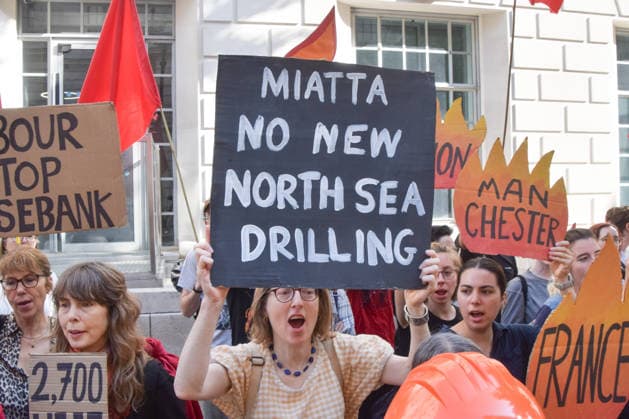 July 22, 2026, London, England, United Kingdom: Climate activists from Fossil Free London stage a protest outside the Department for Energy Security and Net Zero calling on the new Energy Secretary Miatta Fahnbulleh and the new UK Prime Minister Andy Burnham to stop the Rosebank oil and gas field in the North Sea. London United Kingdom - ZUMAv130 20260722_zip_v130_012 Copyright: xVukxValcicx