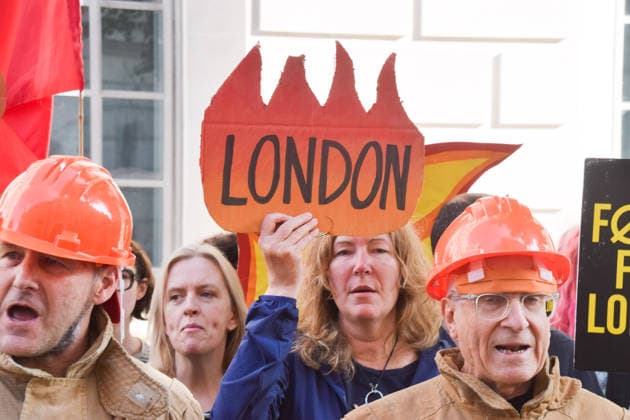 July 22, 2026, London, England, United Kingdom: A protester holds a flame-shaped London sign as climate activists from Fossil Free London stage a protest outside the Department for Energy Security and Net Zero calling on the new Energy Secretary Miatta Fahnbulleh and the new UK Prime Minister Andy Burnham to stop the Rosebank oil and gas field in the North Sea. London United Kingdom - ZUMAv130 20260722_zip_v130_028 Copyright: xVukxValcicx
