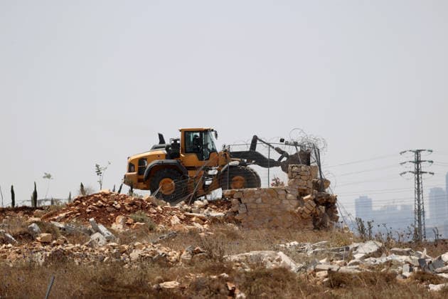 Israeli forces demolish structures in Jerusalem RAFAT, JERUSALEM - JULY 22: Israeli forces, accompanied by bulldozers, carry out a raid in the town of Rafat, northwest of East Jerusalem, on July 22, 2026. During the operation, Israeli authorities demolished a residential house, a car wash facility and two farms, claiming the structures had been built without the required permits. Issam Rimawi Anadolu Jerusalem Rafat. Editorial use only. Please get in touch for any other usage.  Copyright: x2026xAnadoluxIssamxRimawix