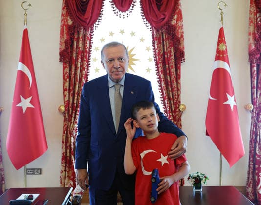 Turkish President Recep Tayyip Erdogan ISTANBUL, TURKIYE - JULY 22: (----EDITORIAL USE ONLY - MANDATORY CREDIT - TURKISH PRESIDENCY MUSTAFA KAMACI HANDOUT - NO MARKETING NO ADVERTISING CAMPAIGNS - DISTRIBUTED AS A SERVICE TO CLIENTS----) Turkish President Recep Tayyip Erdogan meets 12-year-old British activist Joshua Harris, who has autism and is known for his Cake Not Hate campaign against anti-Muslim hate acts, at the Dolmabahce Presidential Working Office in Istanbul, Turkiye on July 22, 2026. TUR Presidency Mustafa Kamaci Anadolu Istanbul Turkey. Editorial use only. Please get in touch for any other usage.  Copyright: x2026xAnadoluxTURxPresidency MustafaxKamacix