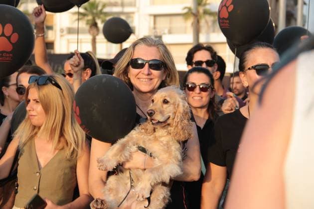 Silent march in Izmir calls attention to stray animal welfare IZMIR, TURKEY JULY 22, 2026: Participants dressed in black walk silently from Pasaport Ferry Terminal to Alsancak Ferry Terminal during an awareness march organized by volunteers to highlight the welfare and rights of stray animals. Carrying black balloons bearing the words One Life Lost, demonstrators complete the march without chanting slogans before delivering a brief press statement at the end of the route. Ä°zmir Türkiye Copyright: x xNagihanxCakirx xJNAxPressx