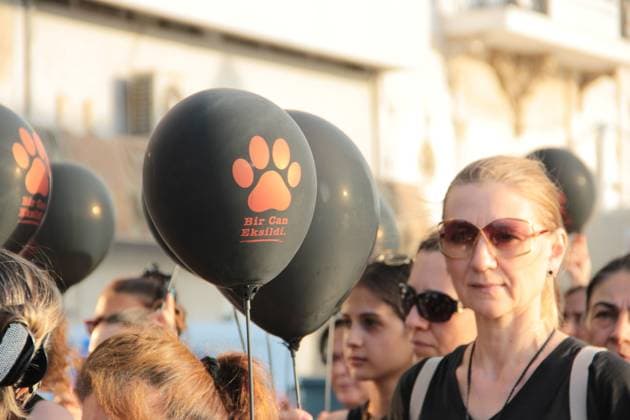 July 22, 2026, Â°Zmir, ToÂ¼rkiye: IZMIR, TURKEY Ã¢â‚¬ JULY 22, 2026: Participants dressed in black walk silently from Pasaport Ferry Terminal to Alsancak Ferry Terminal during an awareness march organized by volunteers to highlight the welfare and rights of stray animals. Carrying black balloons bearing the words One Life Lost, demonstrators complete the march without chanting slogans before delivering a brief press statement at the end of the route. Â°Zmir Türkiye  - ZUMAq101 20260722_zna_q101_219 Copyright: xNagihanxCakirx
