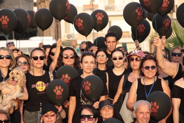 July 22, 2026, Â°Zmir, ToÂ¼rkiye: IZMIR, TURKEY Ã¢â‚¬ JULY 22, 2026: Participants dressed in black walk silently from Pasaport Ferry Terminal to Alsancak Ferry Terminal during an awareness march organized by volunteers to highlight the welfare and rights of stray animals. Carrying black balloons bearing the words One Life Lost, demonstrators complete the march without chanting slogans before delivering a brief press statement at the end of the route. Â°Zmir Türkiye - ZUMAq101 20260722_zna_q101_215 Copyright: xNagihanxCakirx