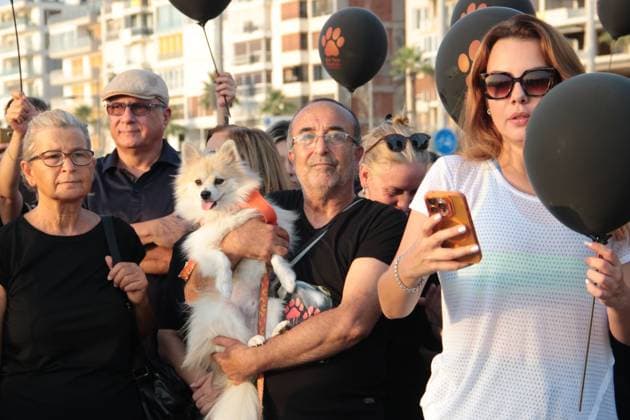 July 22, 2026, Â°Zmir, ToÂ¼rkiye: IZMIR, TURKEY Ã¢â‚¬ JULY 22, 2026: Participants dressed in black walk silently from Pasaport Ferry Terminal to Alsancak Ferry Terminal during an awareness march organized by volunteers to highlight the welfare and rights of stray animals. Carrying black balloons bearing the words One Life Lost, demonstrators complete the march without chanting slogans before delivering a brief press statement at the end of the route. Â°Zmir Türkiye - ZUMAq101 20260722_zna_q101_216 Copyright: xNagihanxCakirx