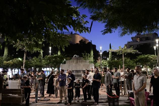 July 22, 2026, Tel-Aviv, Israel: TEL AVIV, ISRAEL Ã¢â‚¬ JULY 22, 2026: Dozens of Jewish worshippers gather at Dizengoff Square in central Tel Aviv for a public reading of the Book of Lamentations on the eve of Tisha B Av, the annual Jewish day of mourning commemorating the destruction of the First and Second Temples in Jerusalem. The observance is marked by prayers, fasting and the reading of biblical texts recalling the tragedies in Jewish history. Tel-Aviv Israel  - ZUMAq101 20260722_zna_q101_225 Copyright: xTomerxNeubergx