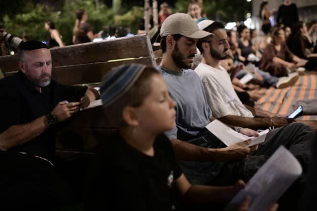 July 22, 2026, Tel-Aviv, Israel: TEL AVIV, ISRAEL Ã¢â‚¬ JULY 22, 2026: Dozens of Jewish worshippers gather at Dizengoff Square in central Tel Aviv for a public reading of the Book of Lamentations on the eve of Tisha B Av, the annual Jewish day of mourning commemorating the destruction of the First and Second Temples in Jerusalem. The observance is marked by prayers, fasting and the reading of biblical texts recalling the tragedies in Jewish history. Tel-Aviv Israel  - ZUMAq101 20260722_zna_q101_234 Copyright: xTomerxNeubergx