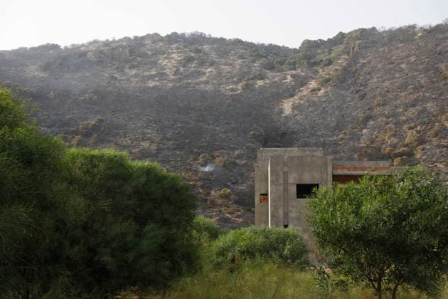 July 22, 2026, Bizerte, Bizerte, Tunisia, Tunisia: Scorched trees are seen on the hills overlooking the coast of Sidi Ali Mekki in the locality of Ghar El Melh on July 22, 2026 after being ravaged by a forest fire. Wildfires broke out the previous night in the heights of Ghar El Melh, Sidi Ali El Mekki, and RafRaf in Tunisia s Bizerte Governorate causing great concern among residents and vacationers. Bizerte Tunisia - ZUMAm342 20260722_zsp_m342_025 Copyright: xHasanxMradx