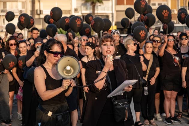 July 22, 2026, Izmir, Turkey: Animal rights advocates seen talking to people during the press conference. Animal rights advocates held a silent march in Izmir, Turkey, to call for the protection of stray animals and their right to life. Following the march, participants issued a statement urging humane and permanent solutions for stray animals while calling on the public to defend the right to life and adopt animals from shelters or the streets. Izmir Turkey - ZUMAs197 20260722_aaa_s197_507 Copyright: xMuratxKocabasx
