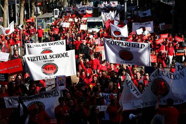 July 23, 2026, Melbourne, Australia: MELBOURNE, AUSTRALIA Ã¢â‚¬ JULY 23, 2026: Members of the Australian Education Union (AEU) march from Bourke Street Mall to the Victorian Parliament during a rally calling on the Victorian Government to fully fund public schools and present a revised Victorian Government Schools Agreement (VGSA). The demonstration forms part of statewide industrial action, with teachers and education support staff seeking improved pay, better working conditions and increased investment in public education. Melbourne Australia  - ZUMAq101 20260723_zna_q101_014 Copyright: xYexMyoxKhantx