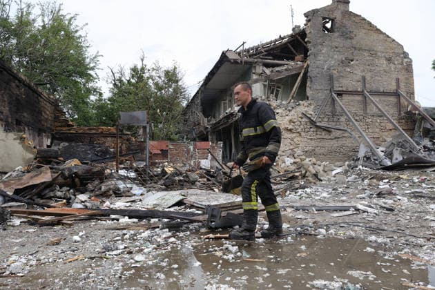 A rescuer passes a two-storey residential building partially destroyed by a Russian drone attack, Odesa, Ukraine, July 22, 2026. In the morning, the Russian army struck the southern port city with attack drones, killing a man and injuring two people - an 82-year-old woman and a 54-year-old man. (Photo by Nina Liashonok Ukrinform) Russian army attacks Odesa with drones, killing 1 man  Copyright: xNinaxLiashonokx