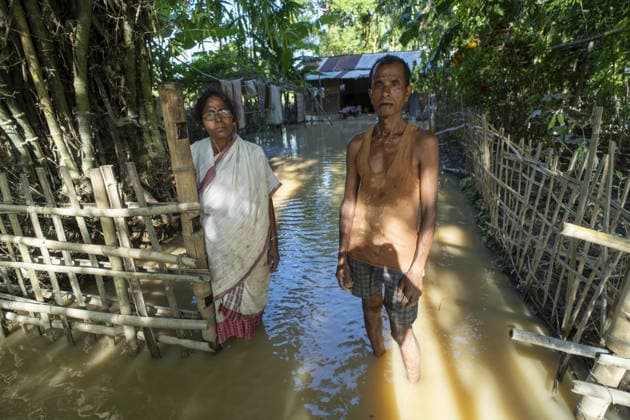 Flood in Indian Northeastern State Assam JORHAT, INDIA - JULY 22: Flood-affected residents stand outside their inundated home in a residential neighborhood, on July 22, 2026 in Jorhat, India. The flood situation in Assam remained critical, with more than 630,000 people affected across 21 districts. The state’s death toll has risen to 12. David Talukdar Anadolu Jorhat India. Editorial use only. Please get in touch for any other usage.  Copyright: x2026xAnadoluxDavidxTalukdarx