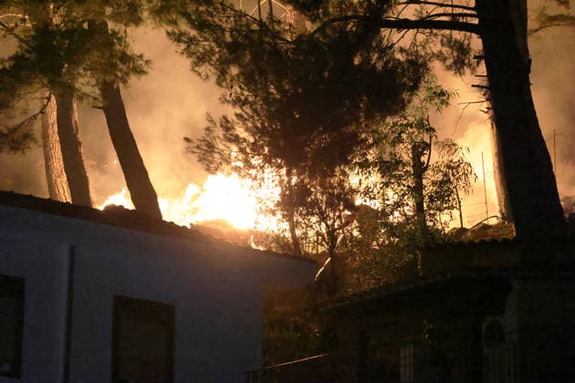 Wildfire threatens communities near Palermo in Sicily as firefighting efforts continue PALERMO, ITALY - JULY 23: Firefighters and civil protection teams battle a wildfire in the Casaboli Forest near Palermo as strong winds push the blaze toward the towns of Monreale, Pioppo and Sagana, while residents are evacuated from threatened homes, in Palermo, Sicily, Italy on July 23, 2026. The wildfire, which started the previous day, spread overnight, prompting emergency crews to work continuously to contain the flames and protect nearby communities. Alberto Lo Bianco Anadolu Palermo Italy. Editorial use only. Please get in touch for any other usage.  Copyright: x2026xAnadoluxAlbertoxLoxBiancox